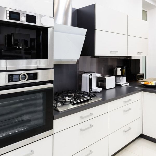 Modern kitchen with Acrylic Matte White cabinet doors and minimalist decor

