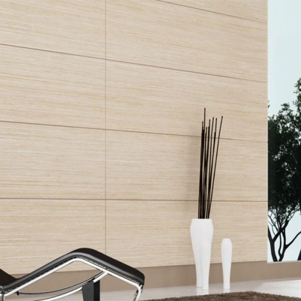 Contemporary lounge space with full wall of bleached oak veneer paneling and floor-to-ceiling windows