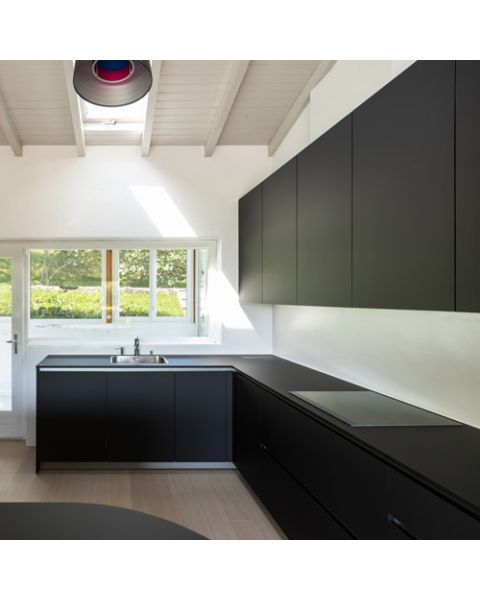 Modern kitchen with Acrylic Matte Black cabinet doors and black appliances