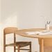 Yute herringbone wall paneling in a dining room, lacquered in soft white Soft Touch