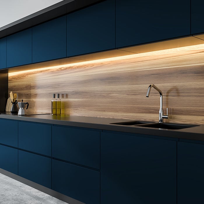 Contemporary kitchen design featuring dark base cabinets and wood veneer backsplash
