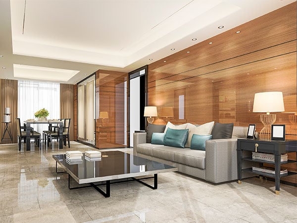 Glossy wood panel wall in upscale living room with neutral tones and modern furniture