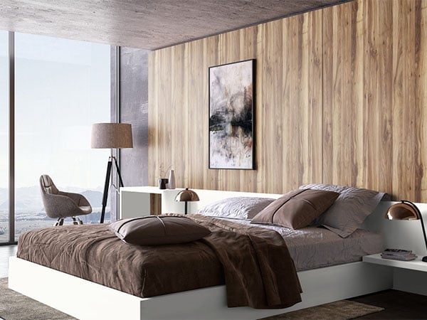 Stylish bedroom featuring walnut wall paneling and neutral design palette