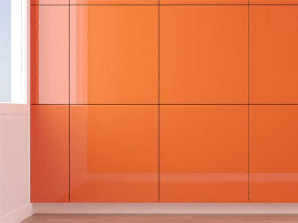 Bold orange lacquer wall paneling with reflective finish and seamless design