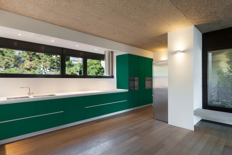 Turquoise Green Cabinetry in an L-Shaped Kitchen